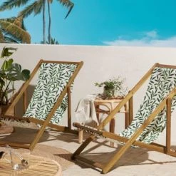 Beliani Bains De Soleil Et Chaises Longues Lot De 2 Chiliennes En Bois D'acacia Clair Avec Toile Motif Feuillage -Fauteuils de jardin Soldes Boutique lot de 2 chiliennes en bois d acacia clair avec toile motif feuillage 1